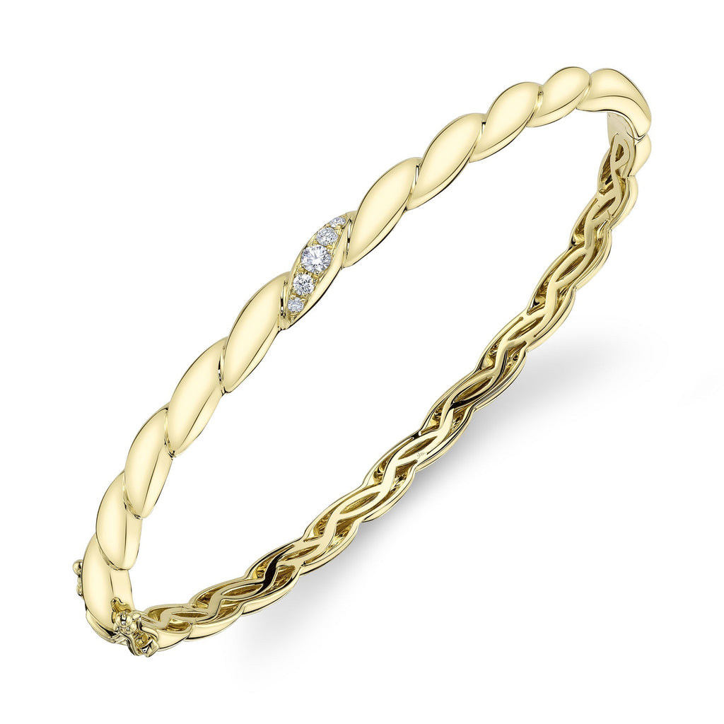Yellow gold bangle with round diamonds.