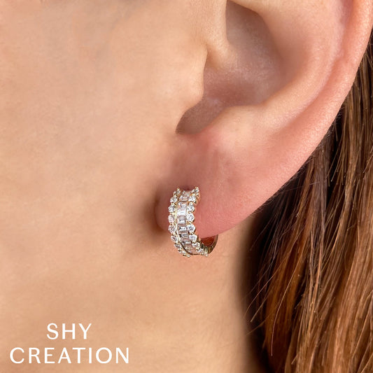 Huggie earrings with varied diamond shapes.