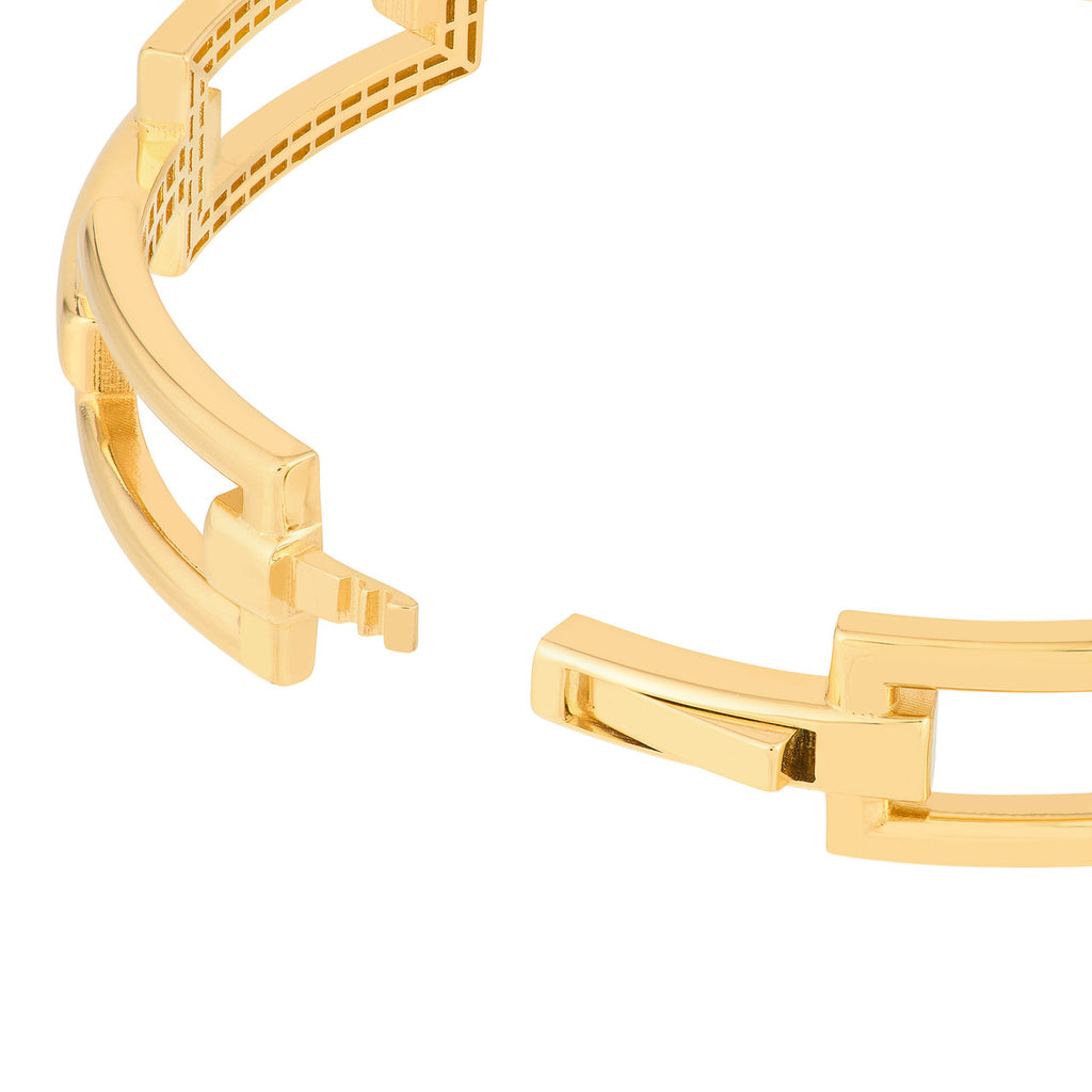 Yellow gold bangle with open geometric links.
