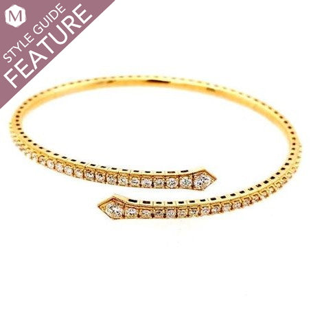 Yellow gold bangle with round diamonds.