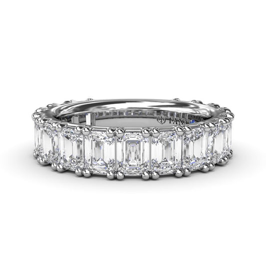 14K white gold band with emerald diamonds.