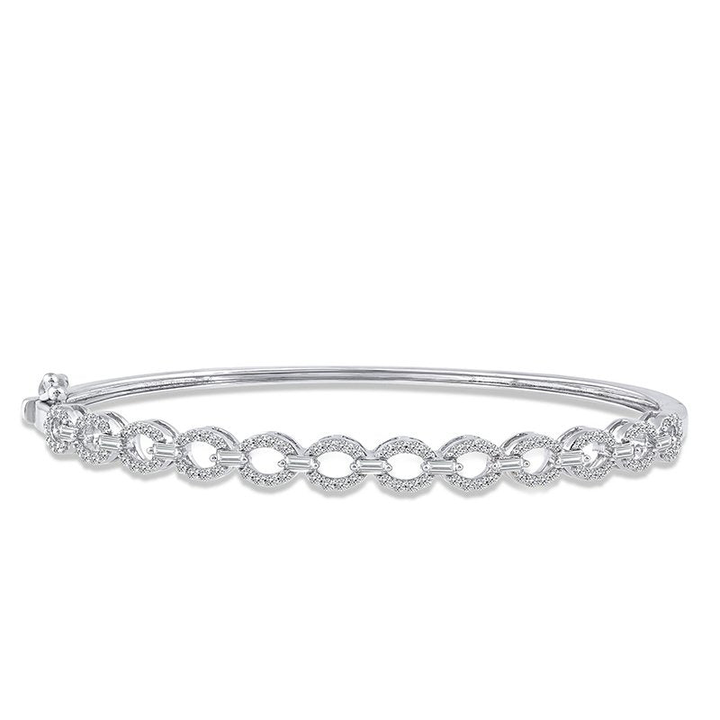 Front view of a white gold bangle bracelet featuring diamond-set oval links with baguette-cut diamond accents.
