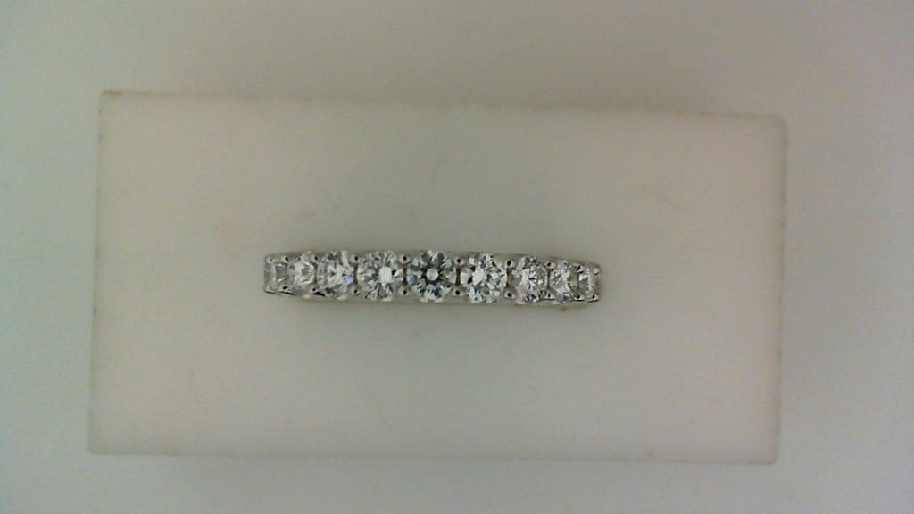 Front view of a white gold wedding band set with a row of round diamonds across the top.