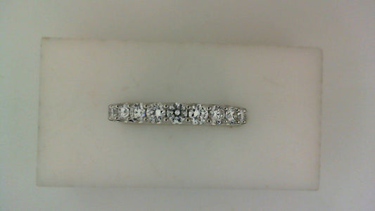Front view of a white gold wedding band set with a row of round diamonds across the top.