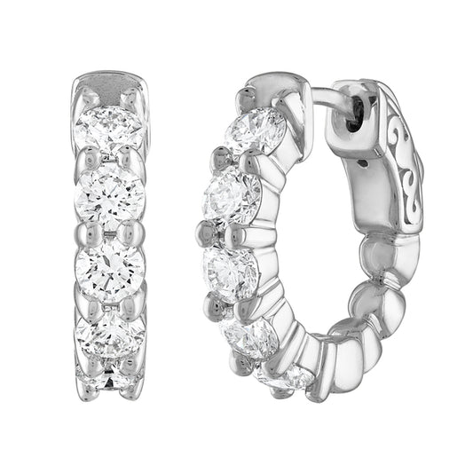 Front and side view of white gold hoop earrings featuring a row of round diamonds in prong settings.