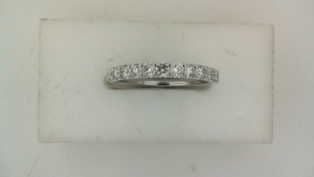Front view of a white gold wedding band set with a row of round diamonds across the top.