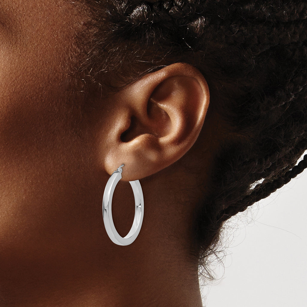 14K white gold medium hoop earrings.