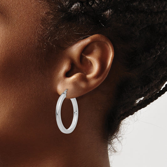 14K white gold medium hoop earrings.