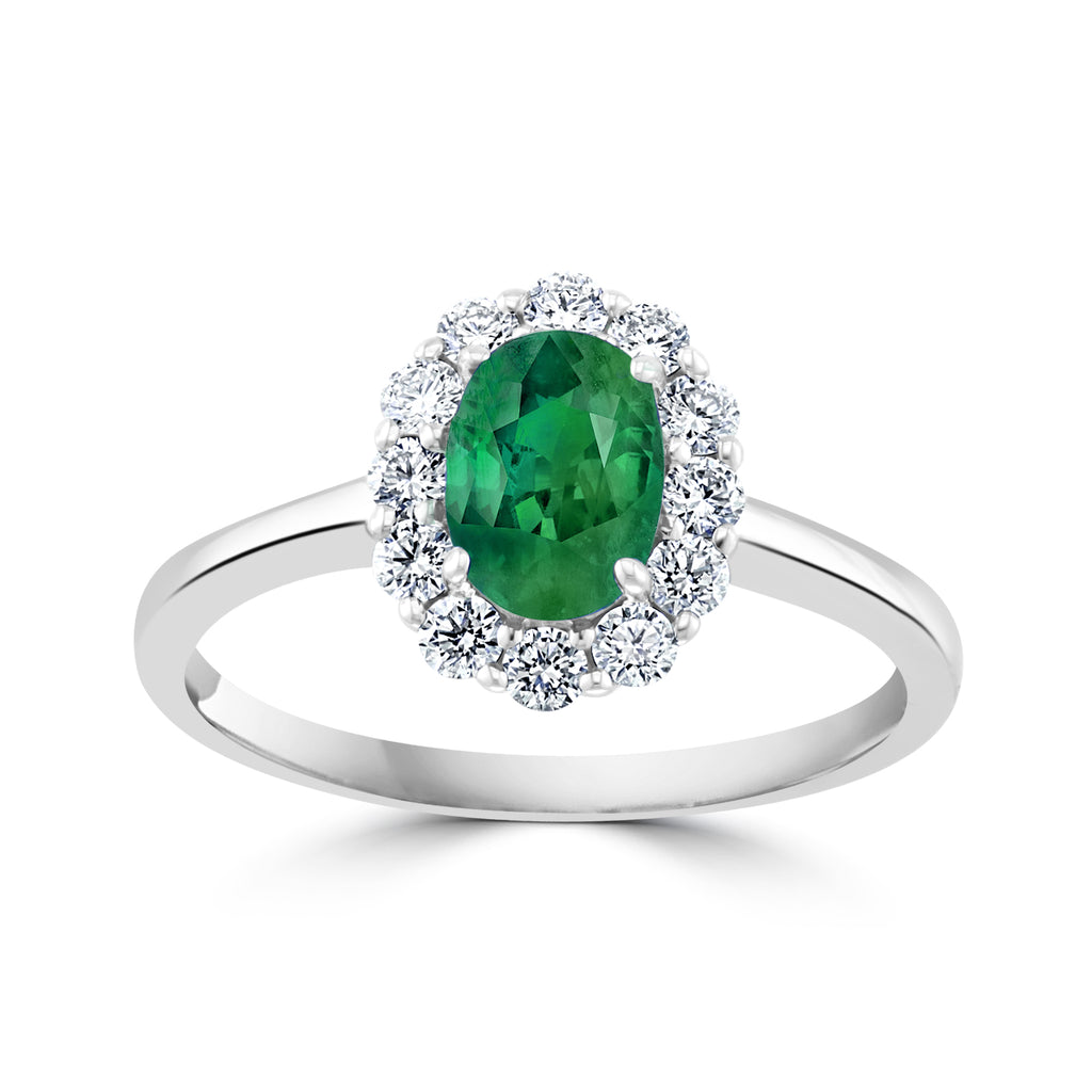 Emerald ring with diamond halo.