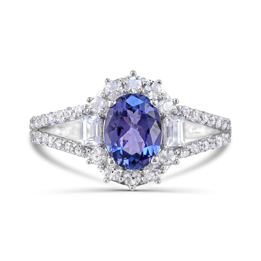 Oval tanzanite ring with white zircon accents.