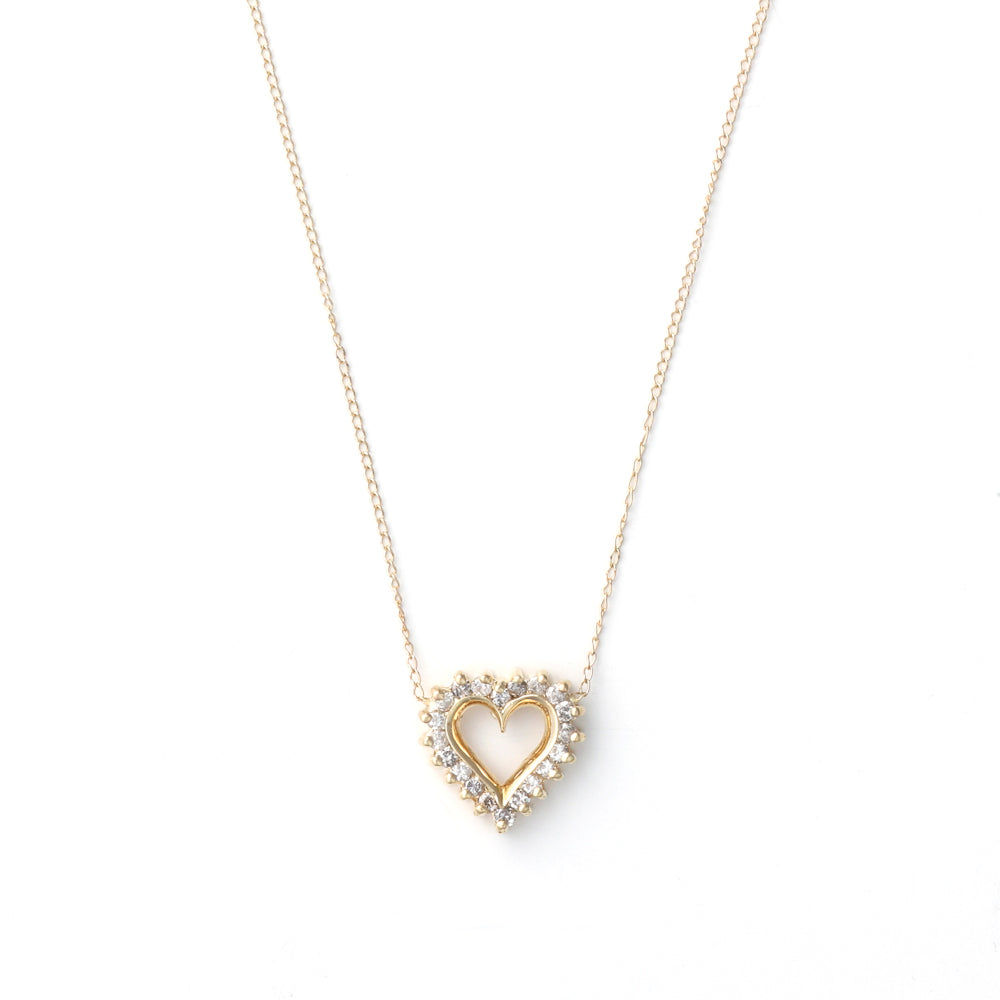 Heart-shaped diamond necklace in yellow gold.