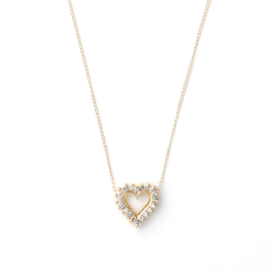 Heart-shaped diamond necklace in yellow gold.