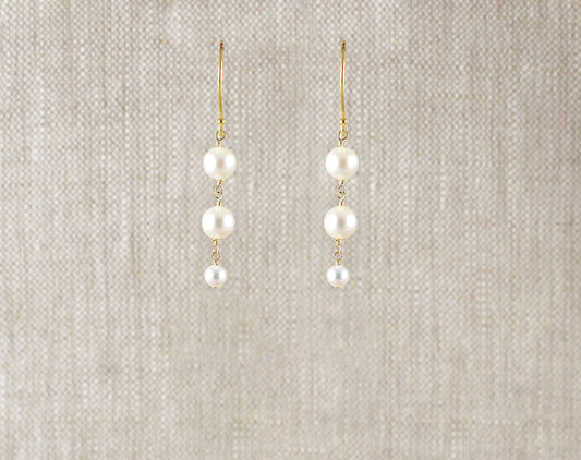 Gold-filled drop earrings with round pearls.