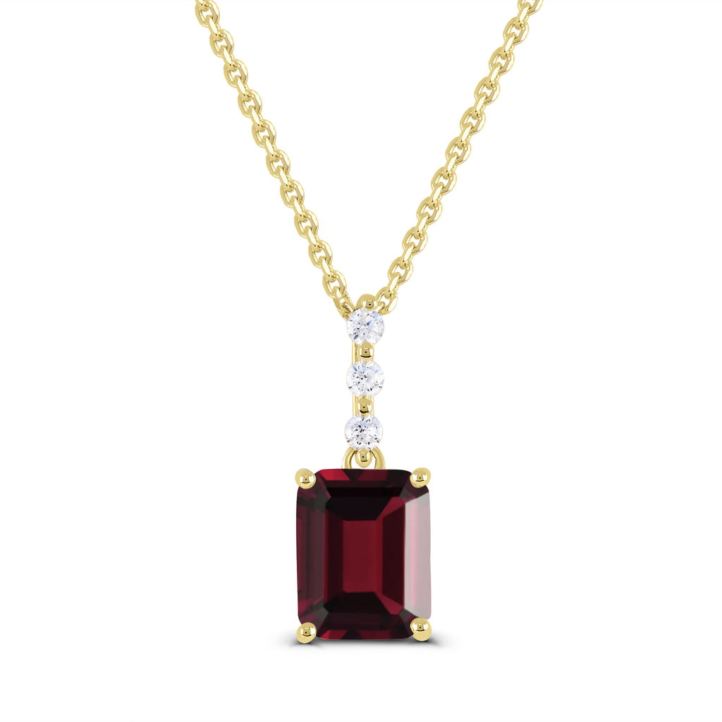 Emerald garnet pendant with diamonds in gold.