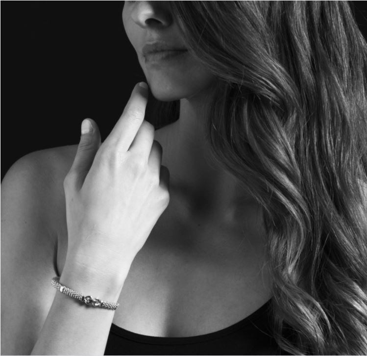 Sterling silver caviar rope bracelet on wrist.
