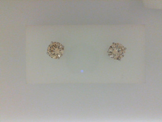 Round diamond stud earrings in white gold.