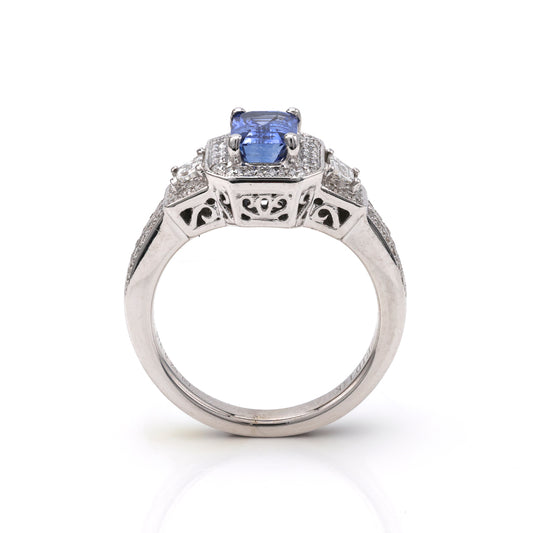 Emerald sapphire ring with diamond accents.