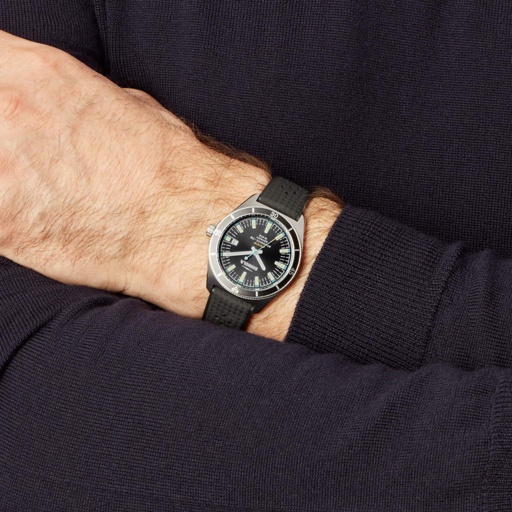 Black dial stainless steel watch, rubber band.