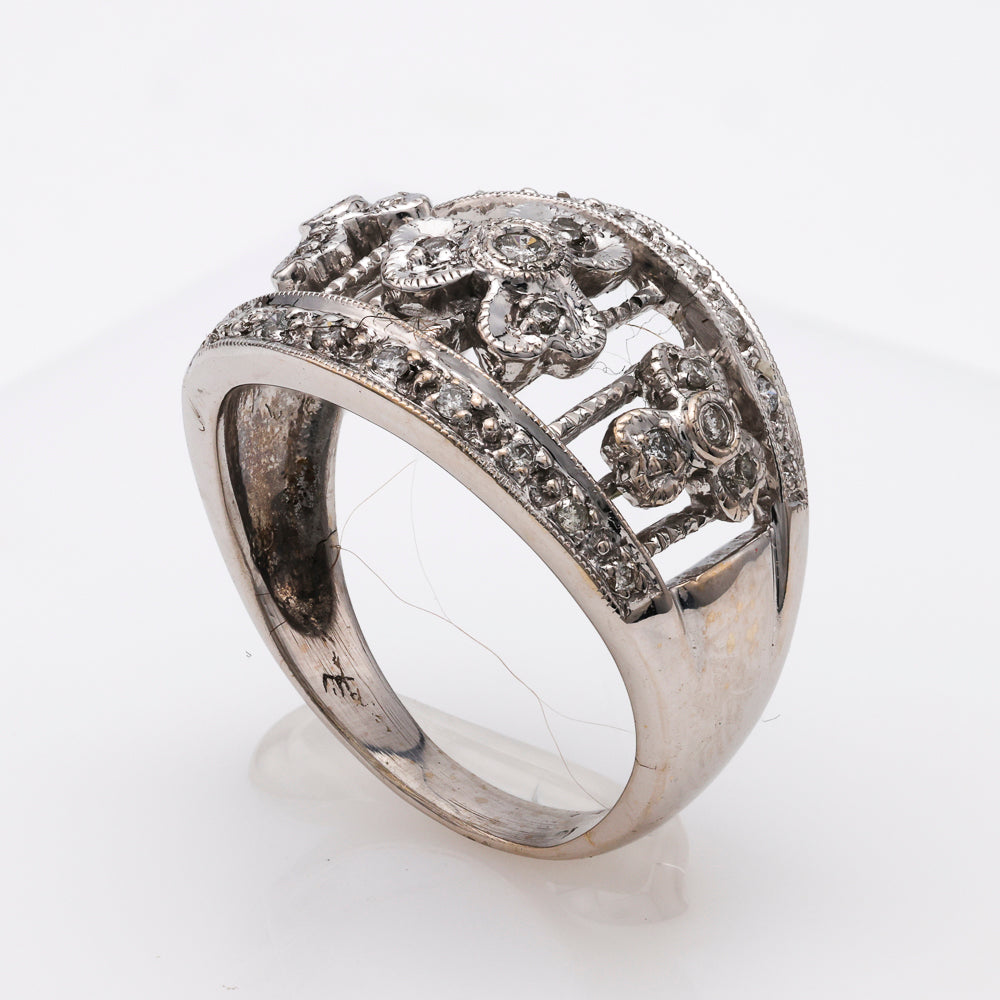 18K white gold ring with diamond floral design.