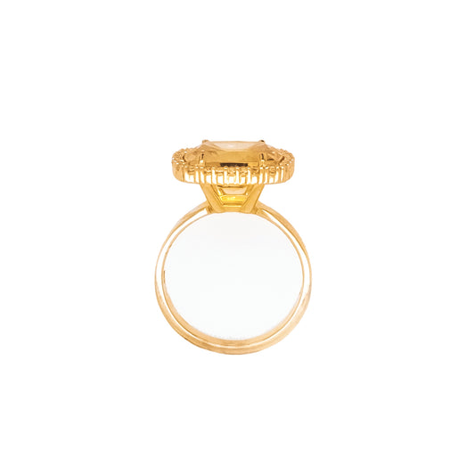 Cushion citrine ring with topaz accents.