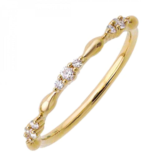 Diamond-accented yellow gold ring with round diamonds.