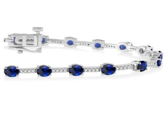 Oval sapphire and diamond station bracelet.