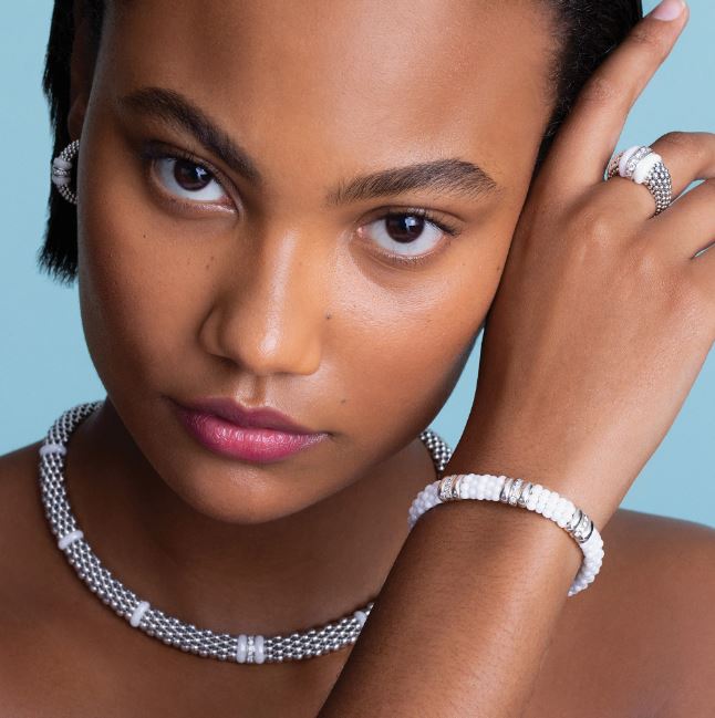 White ceramic diamond bracelet on wrist.