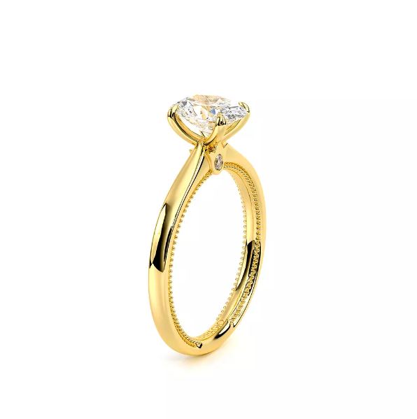 14K gold ring with solitaire diamond.