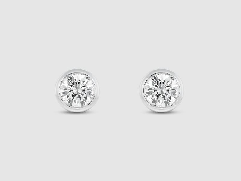 Round lab-grown diamond studs in white gold.