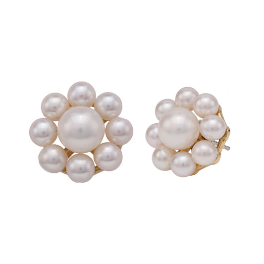 Akoya pearl earrings in yellow gold.