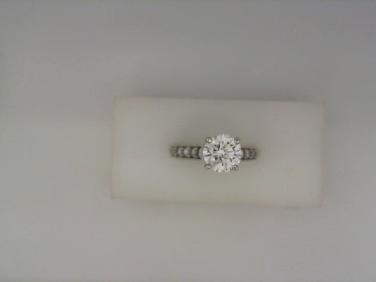 Platinum ring with round side diamonds.