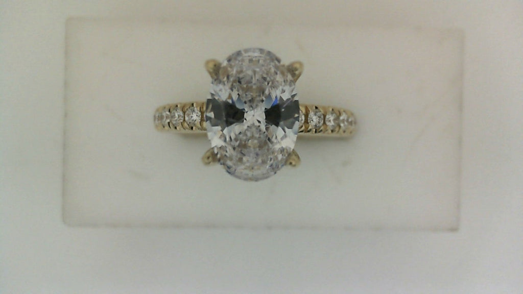 Yellow gold diamond engagement ring with side stones.