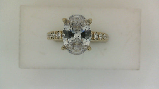 Yellow gold diamond engagement ring with side stones.