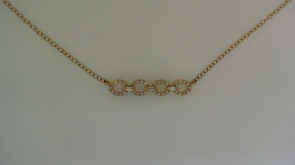 Gold necklace with diamond-studded circular links.