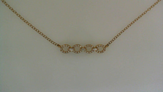 Gold necklace with diamond-studded circular links.