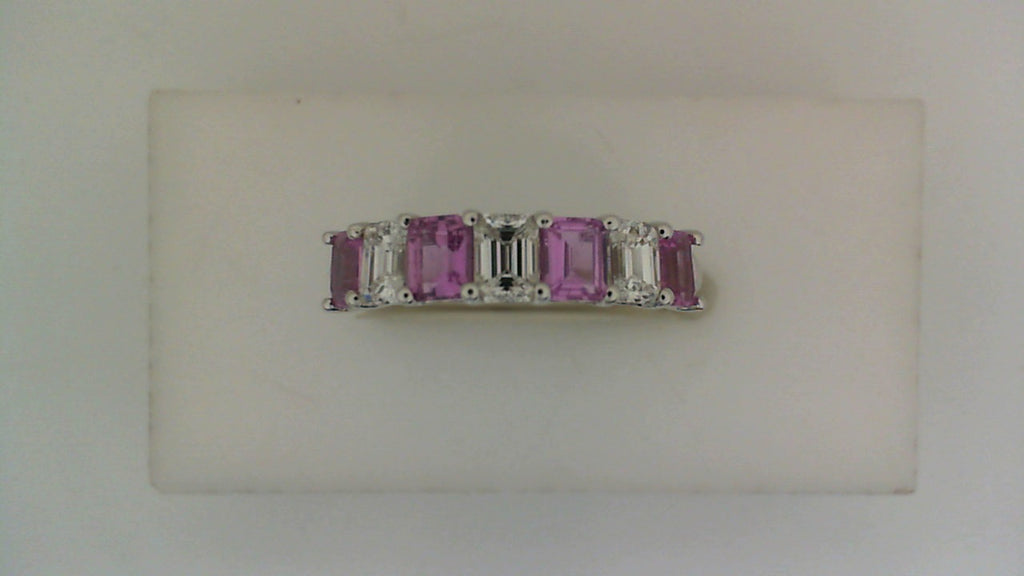 Emerald-cut pink sapphires, white gold band.