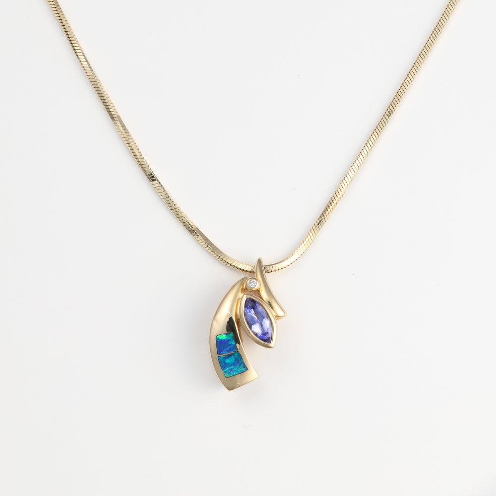Marquise tanzanite pendant with opals and diamond.