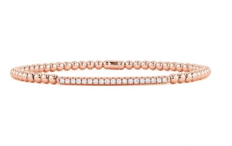 Rose gold bracelet with various shaped diamonds.