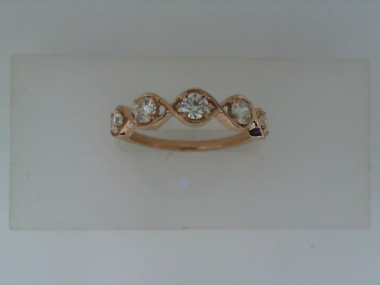 Rose gold ring with five round diamonds.