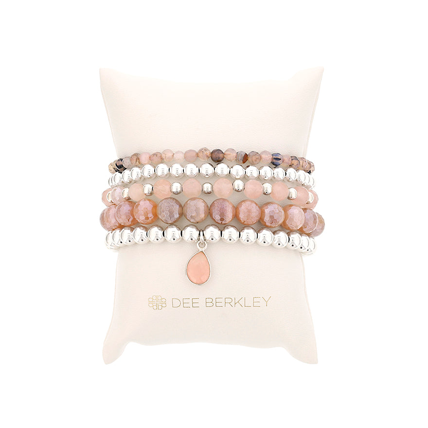 Stretch bracelet with pink gemstones, silver beads.