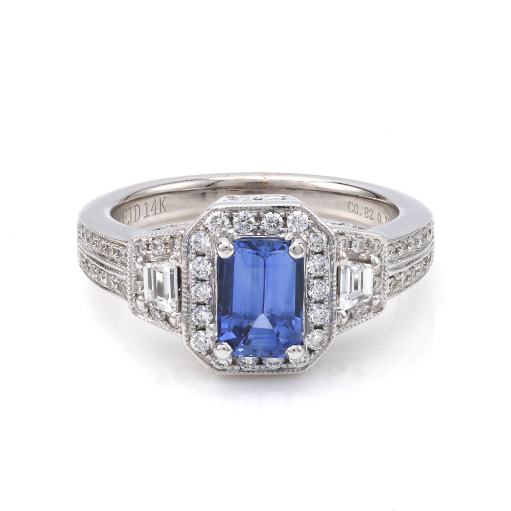 Emerald sapphire ring with diamonds in white gold.