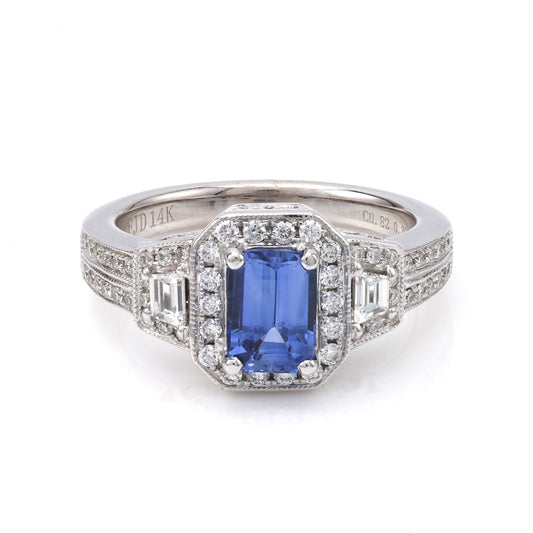 Emerald sapphire ring with diamonds in white gold.