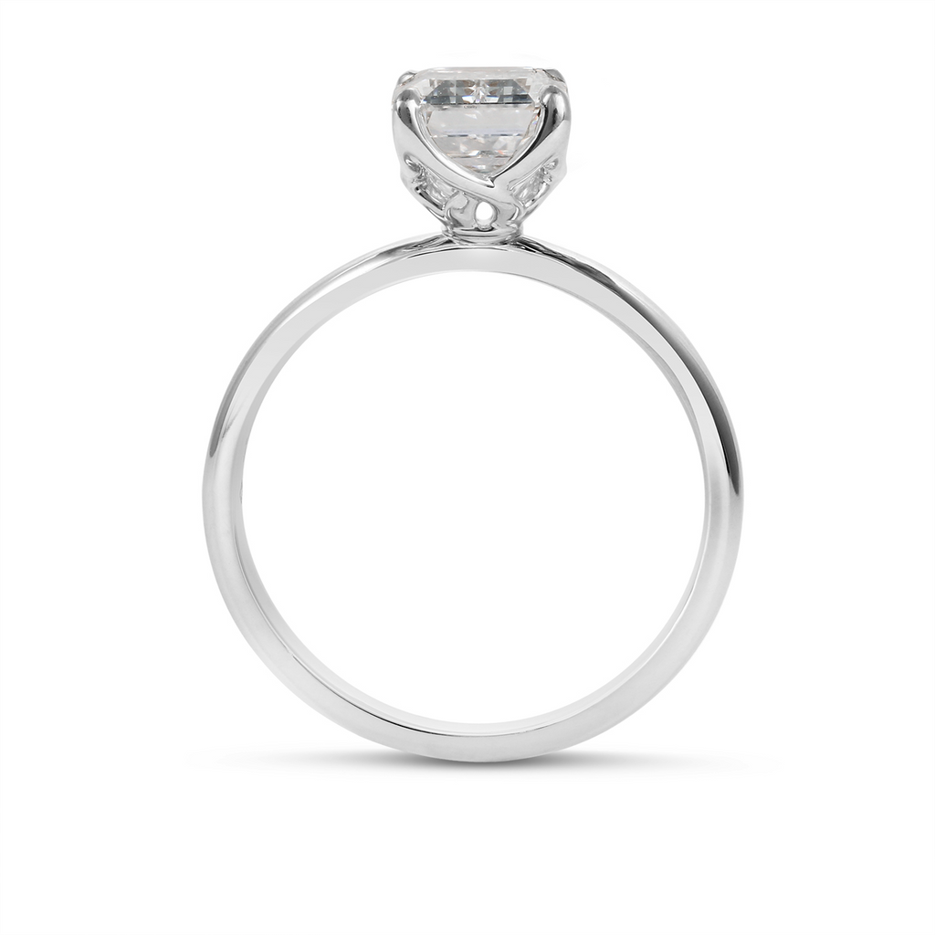 18K white gold solitaire engagement ring.