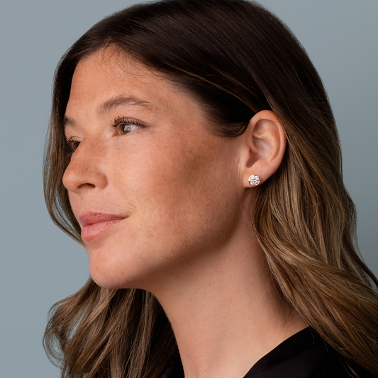 Lab-grown diamond studs in yellow gold.