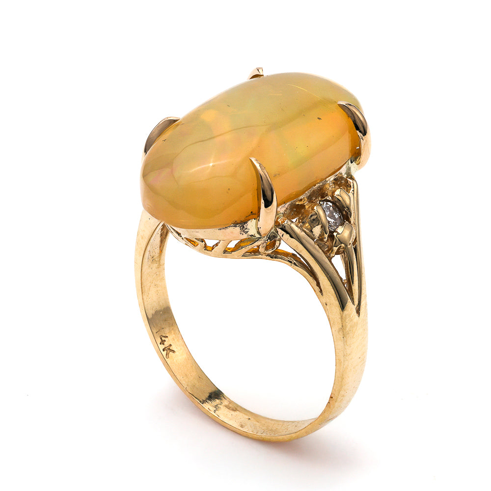 14K yellow gold ring with opal centerpiece.