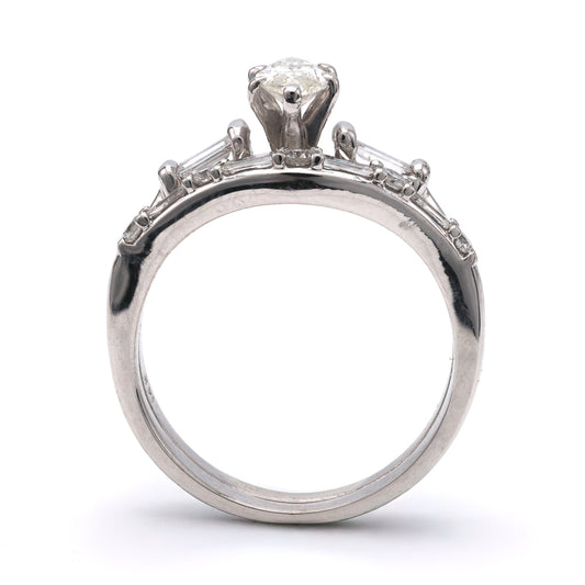 14K white gold ring with marquise diamond.