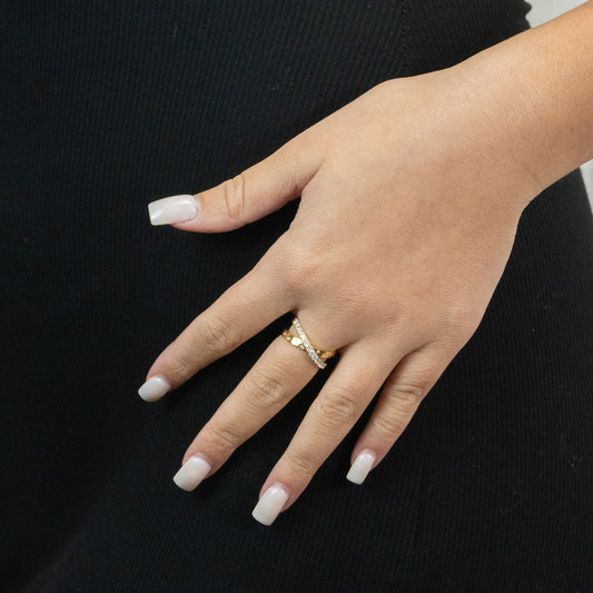 Yellow gold ring with round diamond accents.