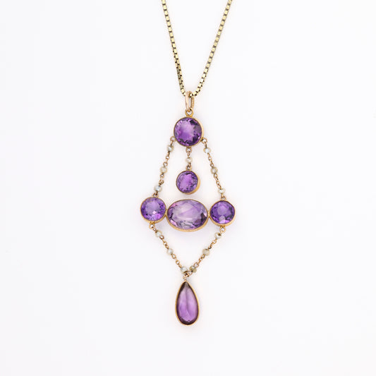 Amethyst pendant with various shapes in gold.