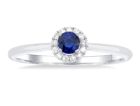 Sapphire ring with diamond halo in white gold.