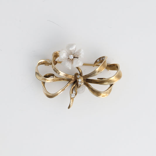Floral bow pin with pearls, diamonds, gold.